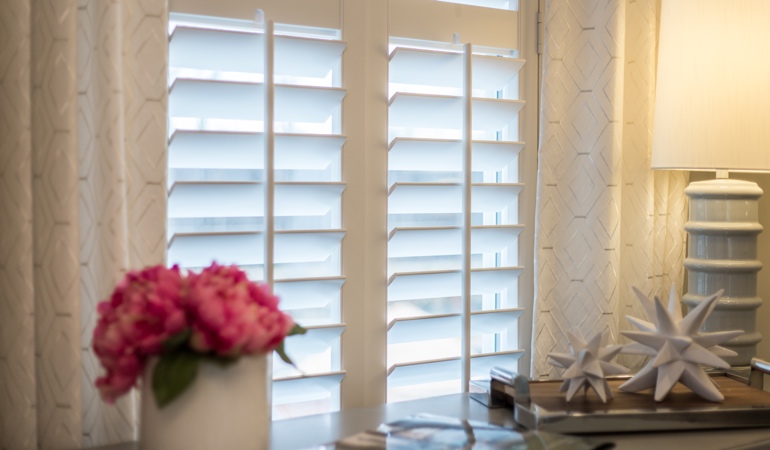 Plantation shutters by flowers in Honolulu